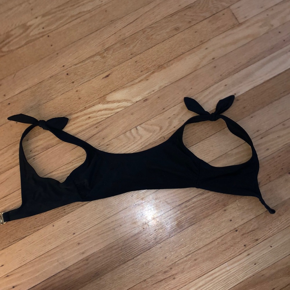 Black bikini top and yellow floral bikini top